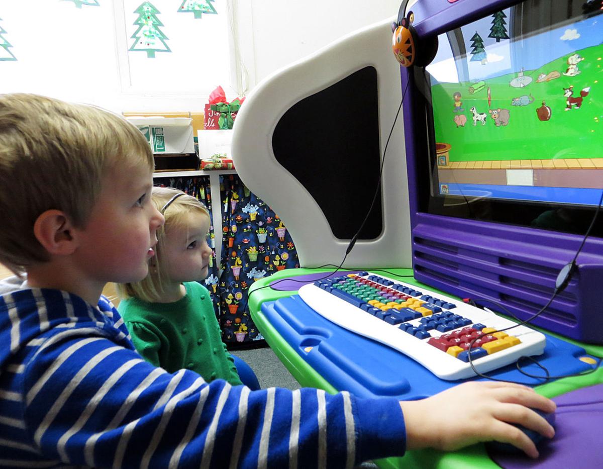 WACS preschoolers explore with new computer
