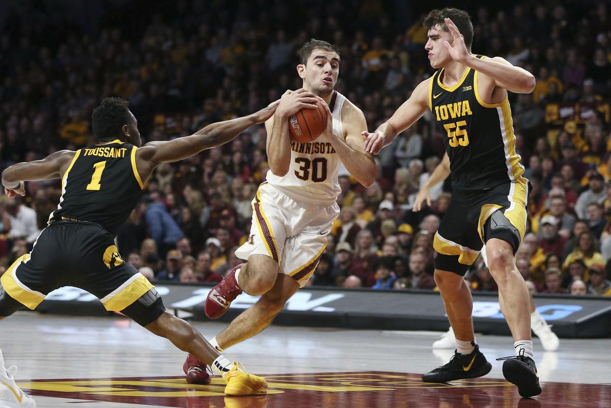 College Basketball Iowa Holds Off Gophers In Big Ten Battle