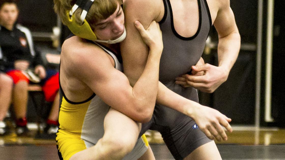 STANDING ON TOP Winona's Ryan Henningson climbs his way to the top of