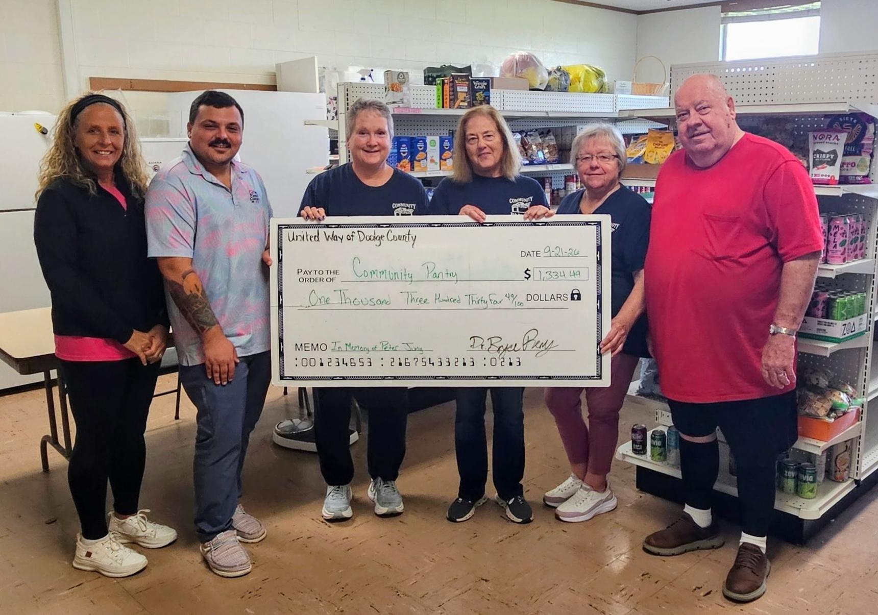 From left, Tammy Appel, United Way of Dodge County Board Member; Bryce Remy, UWDC president; present a $1,334.49 donation to Wendy Wellhoefer, Community Pantry chairperson; Mary Bogenschneider, CP Board Member; Terri Roemer, CP Board Member; Larry Mondenhauer, Community Pantry Board treasurer, on Sept. 21.