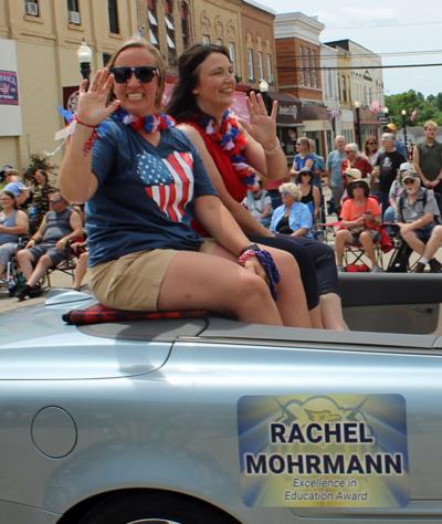 Rachel Mohrmann, left, and Heidi Justus ride in the Big Top Parade on June 13 in downtown Baraboo.