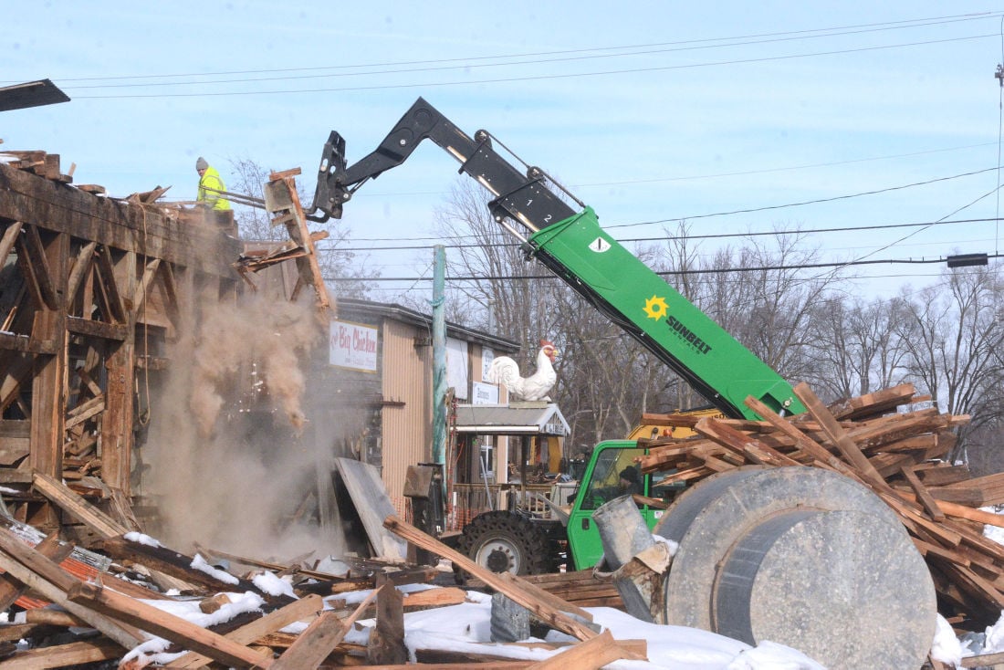 Big Chicken flies the coop Antiques store settles with county, buys