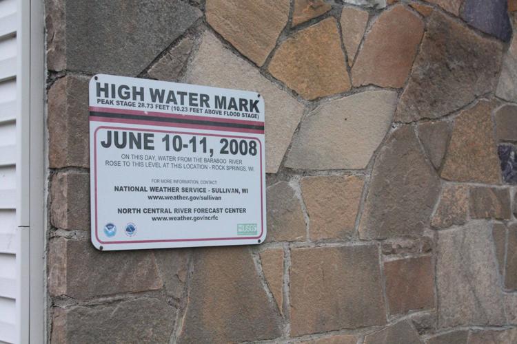 High water mark on side of community center