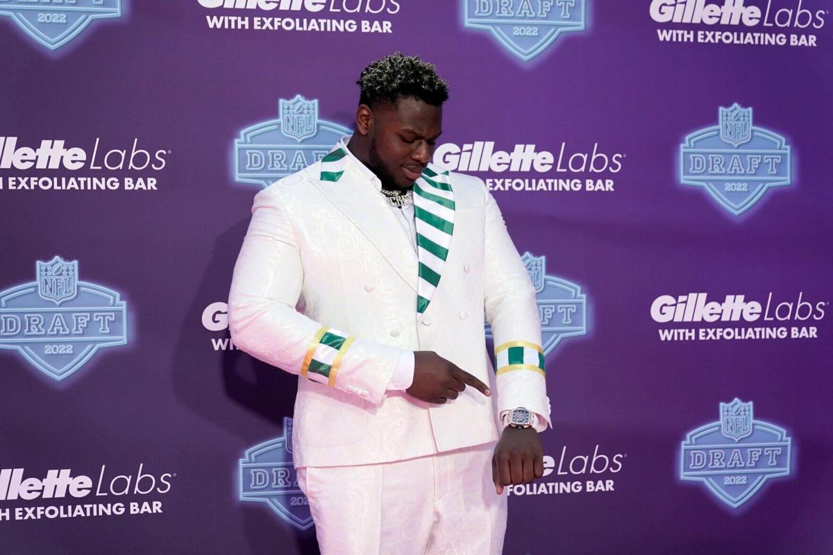 North Carolina State offensive tackle Ikem Ekwonu stands with NFL  Commissioner Roger Goodell after being picked by the Carolina Panthers with  the sixth pick of the NFL football draft Thursday, April 28