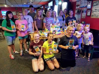 4-H club donates school supplies