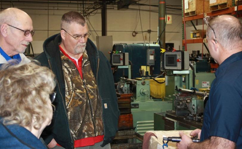 Graewin demonstrates machinery to mayor