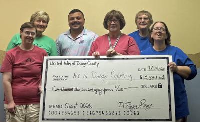 United Way of Dodge County awards a $5,384.61 grant to The Arc of Dodge County on July 28. From left, Tiffany Berndobler, Arc; Mary Pat Boschert, Arc; Bryce Remy, UWDC; Bernie Hafenstein, Arc; Marne Berndobler, Arc; Joell Dornbrook, Arc.