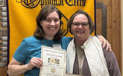 Kristie Gander, left, executive director of Kids Ranch, accepts a $400 donation from Shari Diehl, Sauk Prairie Optimist Club member, at the April 1 club meeting.