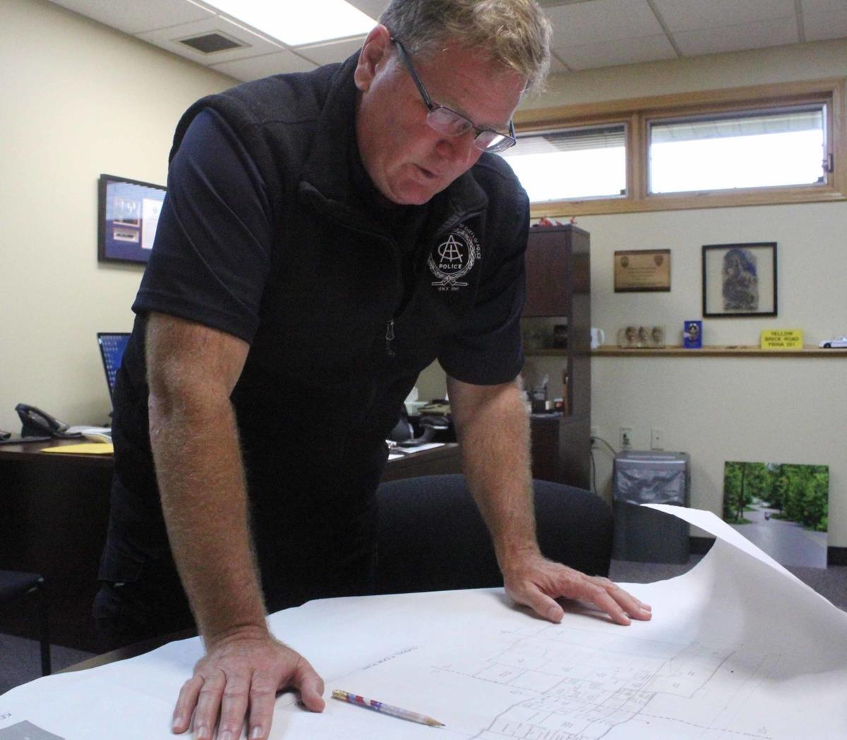 Daniel shows plans for police station