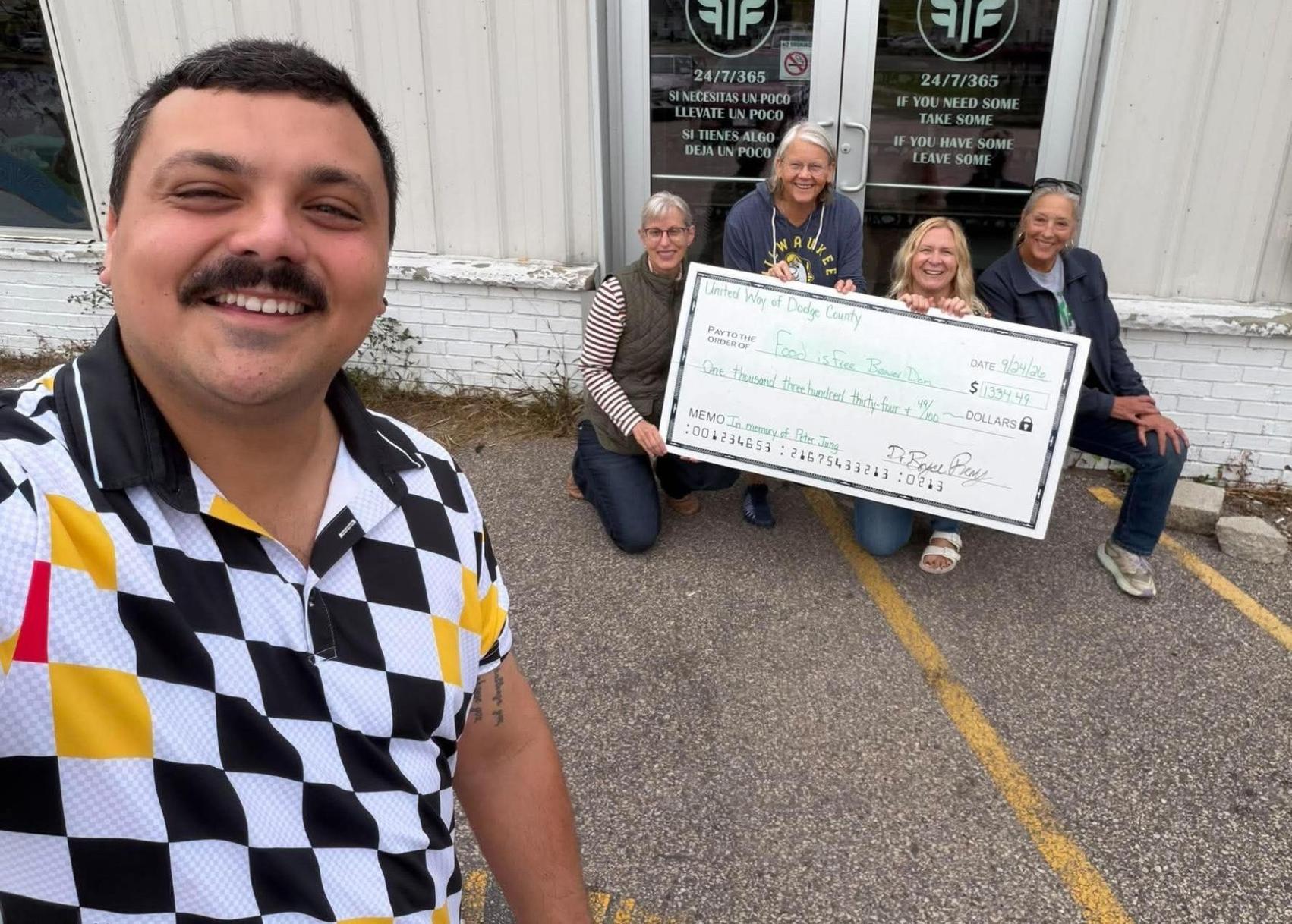 From left, Bryce Remy, United Way of Dodge County president; presents a $1,334.49 donation to Food is Free pantry volunteers: Brenda Utzerath, Laurie Geschke, Emily Dieringer, Sharon Lubkeman on Sept. 24.