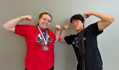 Wayland Academy students Ella Kikkert, left, and Albert Kim pose after a successful competition at the Wisconsin High School Powerlifting Association State Meet on March 8.