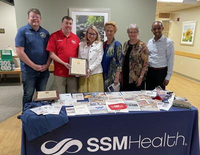From left, Sen. John Jagler, Rep. Mark Born, present DeAnn Thurmer, president of SSM Health St. Clare Hospital - Baraboo, SSM Health Ripon Community Hospital, and SSM Health Waupun Memorial Hospital, with a legislative proclamation recognizing the 75th anniversary of SSM Health WMH during the celebration on June 28. Congregation of Sisters of St. Agnes representatives Sister Rhea Emmer and Sister Mary Noel Brown, and Dawit Tesfasilassie, SSM Health Wisconsin Region regional vice president, Acute Care Operations, also present.
