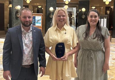 Sen. Sarah Keyeski, center, recognized with a Wisconsin Counties Association Outstanding Legislator Award on June 30, by WCA Government Affairs Associates Collin Driscoll, right, and Chelsea Shanks.