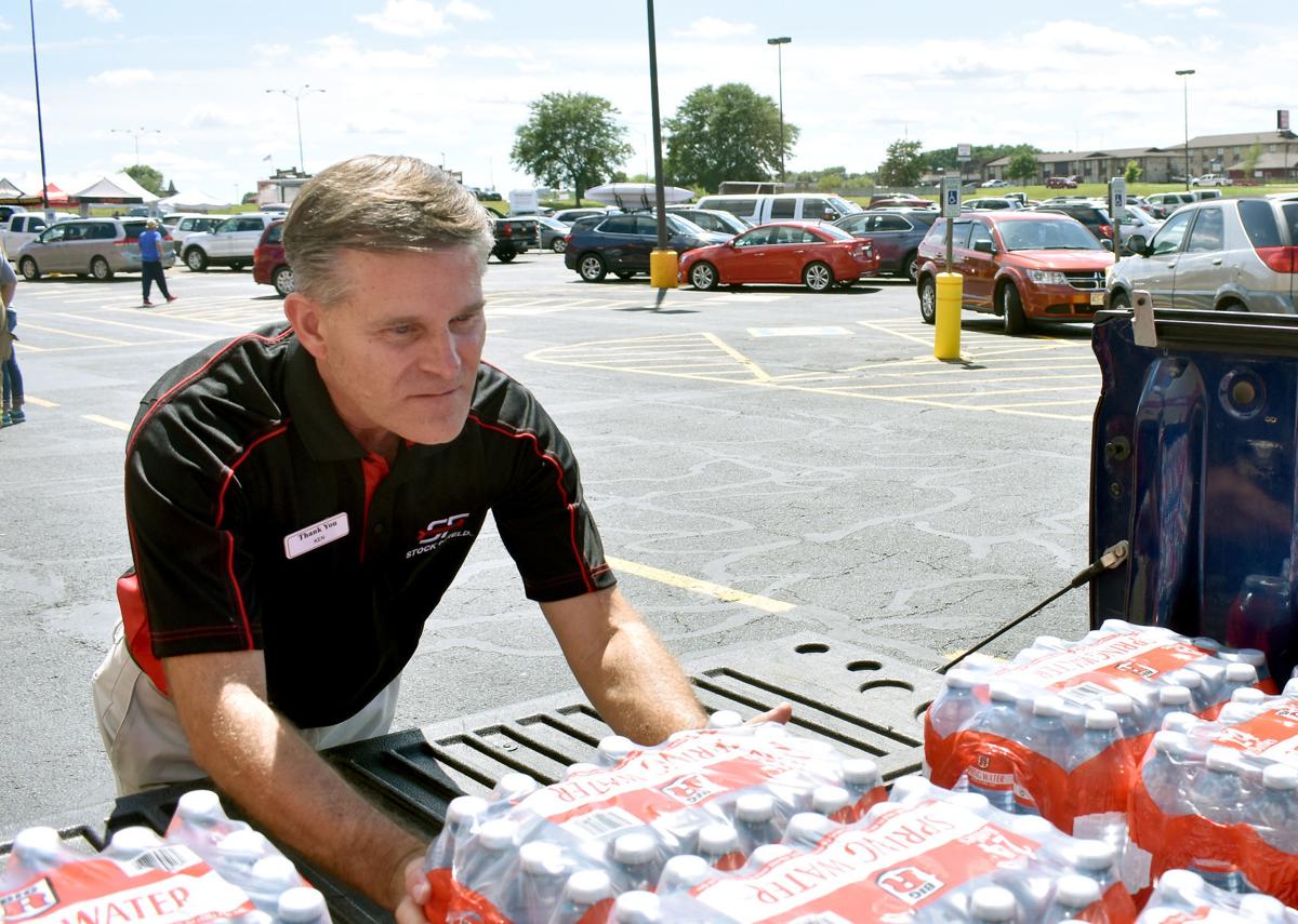 Ken Frey loading water onto truck