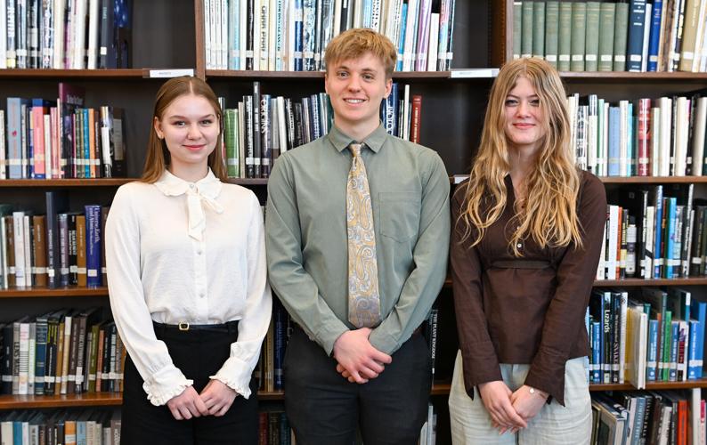 Wayland Academy’s class of 2027 junior marshals, from left, Uliana Zabolotna, Daniel Brunstad, and Mary Whittier.