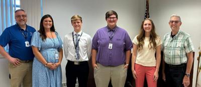 From Left, county administrator Cameron Clapper; community development marketing and communications manager Morgan Muche; Braxton Soldner from Dodgeland High School, Carter Wild from Horicon High School, and Paige Murphy from Lakeside Lutheran High School; and board chair Dave Frohling following the interns' presentation at the Executive Committee on Aug. 3.