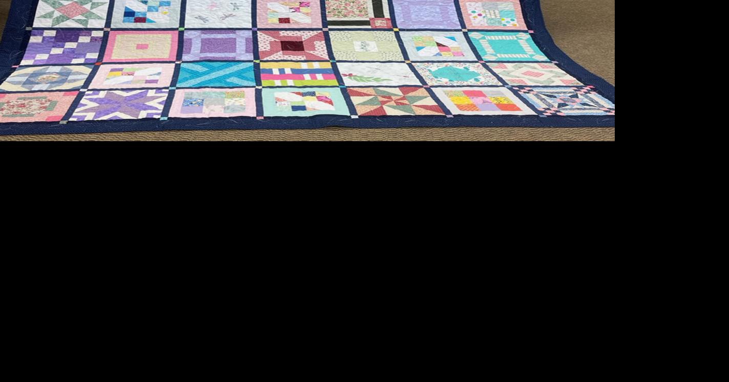 Local quilters donate quilt to library auction