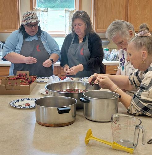 Making strawberry freezer jam, from left, Dee Weeter, Cathy Christensen, Mary and Sherry Fry on June 14.