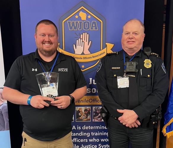 School Resource Officer Matthew Edwards, left, recognized as the 2026 Wisconsin Juvenile Officers Association “SRO of the Year” by the Wisconsin School Safety Coordinator Association on March 5-6, stands with Beaver Dam Police Chief John Kreuziger.