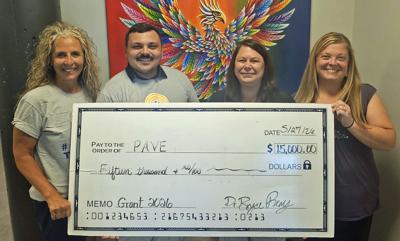 United Way of Dodge County representatives, from left, Tammy Appel and Bryce Remy, present a $15,000 grant to PAVE representatives, Angela Rheingans and Tammy Eilbes on May 27.