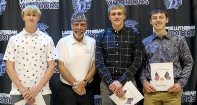 Lakeside Lutheran seniors, from left, Carter Knorr, Gabe Weidner and Owen Fleming were each awarded $500 Sons of the American Legion scholarships by Squadron 67 rep, Darryl Krejci, at the May 6 school awards night.