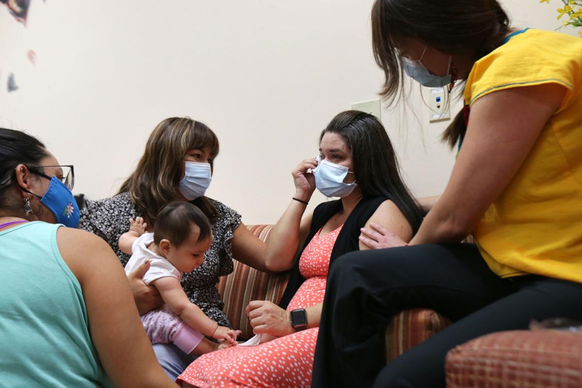 Jennifer being comforted by Maricela and others