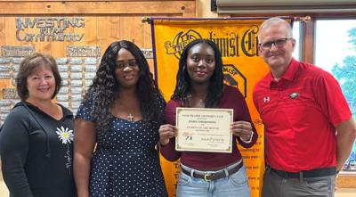 From left, Roxi Maier, Optimist member and president-elect; Jite and Daisy Omorodion, with  Sauk Prairie High School assistant principal Shane Been on Sept. 16.