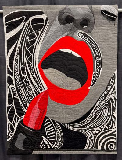 "Elegantly Red; the Final Swipe" by Carol Preston, is part of the Dodge County Center for the Arts quilt exhibit..