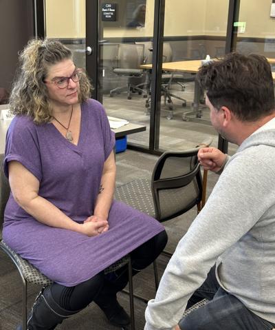 Toshia Martin and John Peruzzi practice remaining nonreactive during Dr. Ruthanne Chun's session at the May 14 Sauk County Institute of Leadership meeting.
