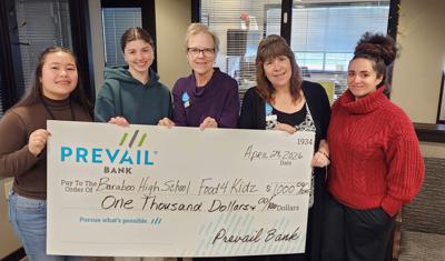 From left, Jasmine Szweda and Elliana Scholler from Baraboo High School’s Interact Club accept a $1,000 donation from Prevail Bank professionals Kristi Anderson, Susan DeVoe, and Tara Mangino on April 29.