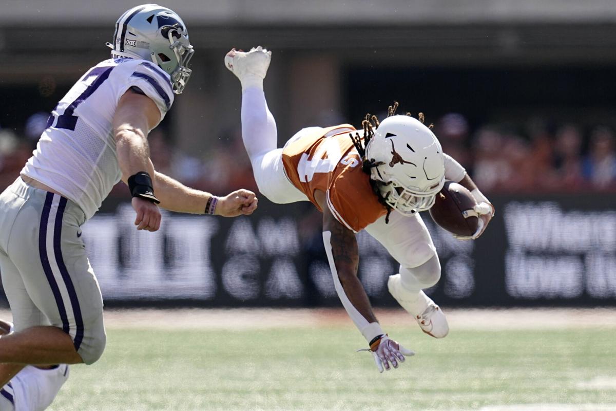 Texas stays in playoff hunt, survives KState in OT
