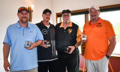 The 2025 winners of the Big Red Classic, from left, Jeff Krenz, Josh Krenz, Ted Krenz, and Rob Sober with their championship rings.