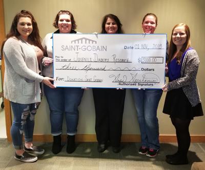 St. Gobain donates to JDRF team