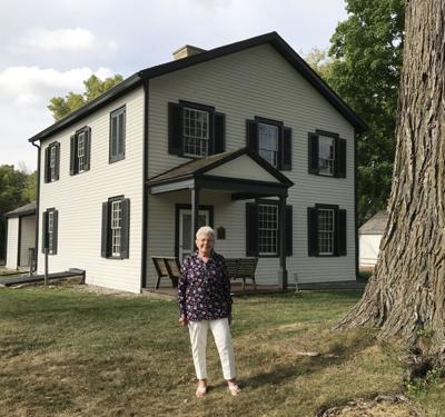 Beverly Bailey, a second great-granddaughter of Pierre Pauquette, stands in front of the Historic Indian Agency House. Stories of the Metis families will be shared around the campfire Saturday at Historic Indian Agency House.