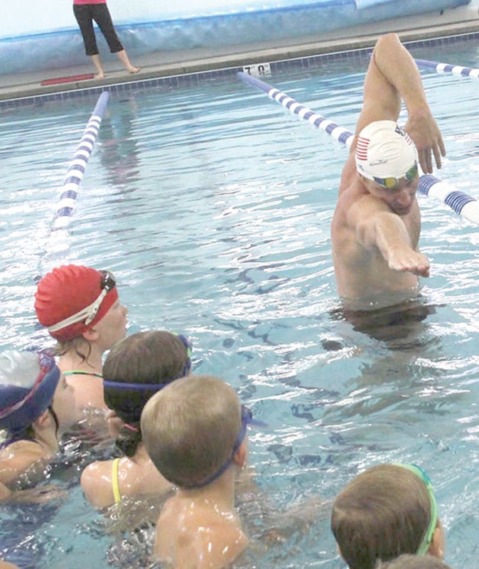 GETTING ALONG SWIMMINGLY Olympic gold medalist Davis pays visit to