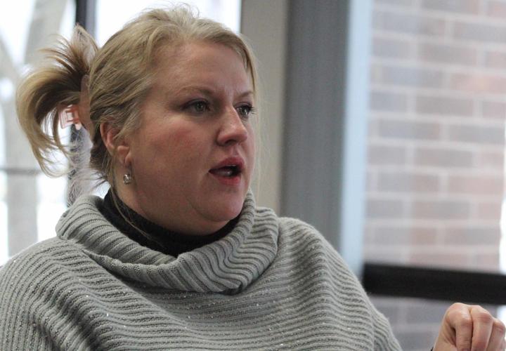 Jenifer speaks at meeting