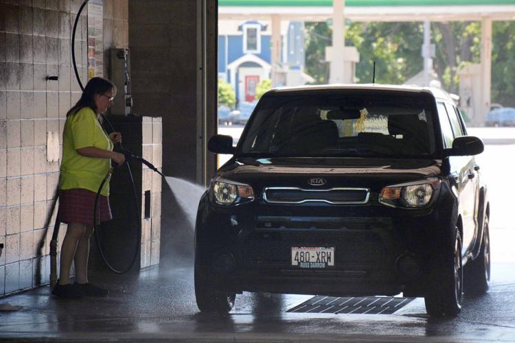 Baraboo homeowner frustrated by car wash runoff entering her property
