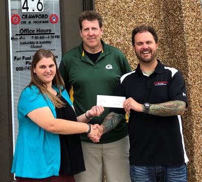 Crawford Oil gives $600 to homeless shelter