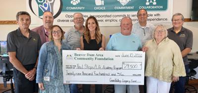 Representatives of Green Valley Enterprise, Opportunities Inc., and the Green Valley Legacy Fund pose, from front left, Angela Van Heesch, Kayla Schumacher, Greg Armstrong, Barb LeDuc; back row, Larry Lange, Greg Giles, Jay Vanden Boogart, Jason Frey, Tom Heffron on June 10.