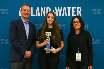 From left, Matt Krueger, Wisconsin Land+Water executive director, Leah Gorsuch, Wisconsin Dells High School, first-place state speaking contest, Thelma Heidel-Baker, USDA Natural Resources Conservation Service in West Bend on April 20.