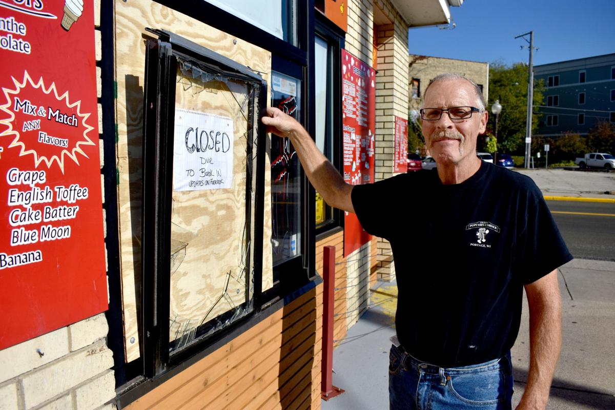Mitchel Craig shows broken window