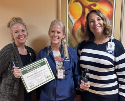 Rebecca “Becca” Stephenson, center, an SSM Health St. Clare Hospital - Baraboo Radiation Oncology registered nurse, receives a DAISY Award from hospital leaders Melissa Heathers, left, and Mary LaHam, according to a July 2 release.