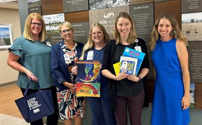 From left, Ginger Giebel, RN, SSM Health Fond du Lac Regional Clinic clinical operations manager and Reach Out and Read site coordinator; Deb Winterhack, Agnesian HealthCare Foundation director of development; Desa Rico, RN, site coordinator; Holly Haberman, MD, family medicine physician and Reach Out and Read physician medical champion; and Alex Rogers, Reach Out and Read program manager; display some of the books that will be available for pediatric patients during well-child visits, according to a Sept. 17 release.