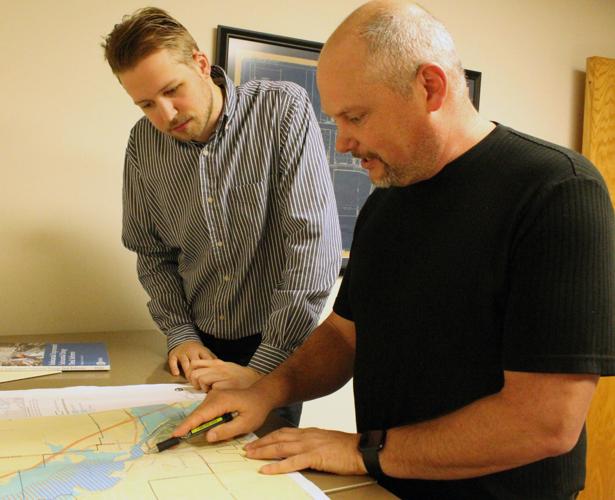 Zach and Randy look at flood map
