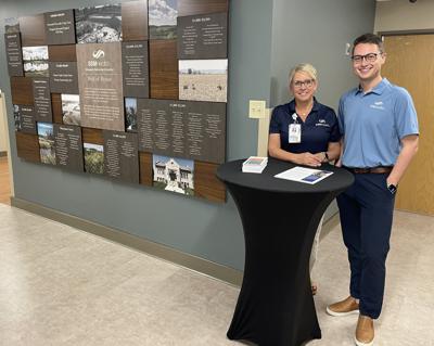 Deb Winterhack, left, and Mason Gravelle, Agnesian HealthCare Foundation, stand by the new donor wall at SSM Health Waupun Memorial Hospital, which was unveiled during the hospital’s 75th anniversary on June 28.