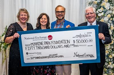From left, Bonnie Baerwald, Moraine Park president; Dana Bourland, Moraine Park director of college advancement; Adam Stone, NEB Foundation board member; John St. Peter, Moraine Park Foundation board member, on April 23.