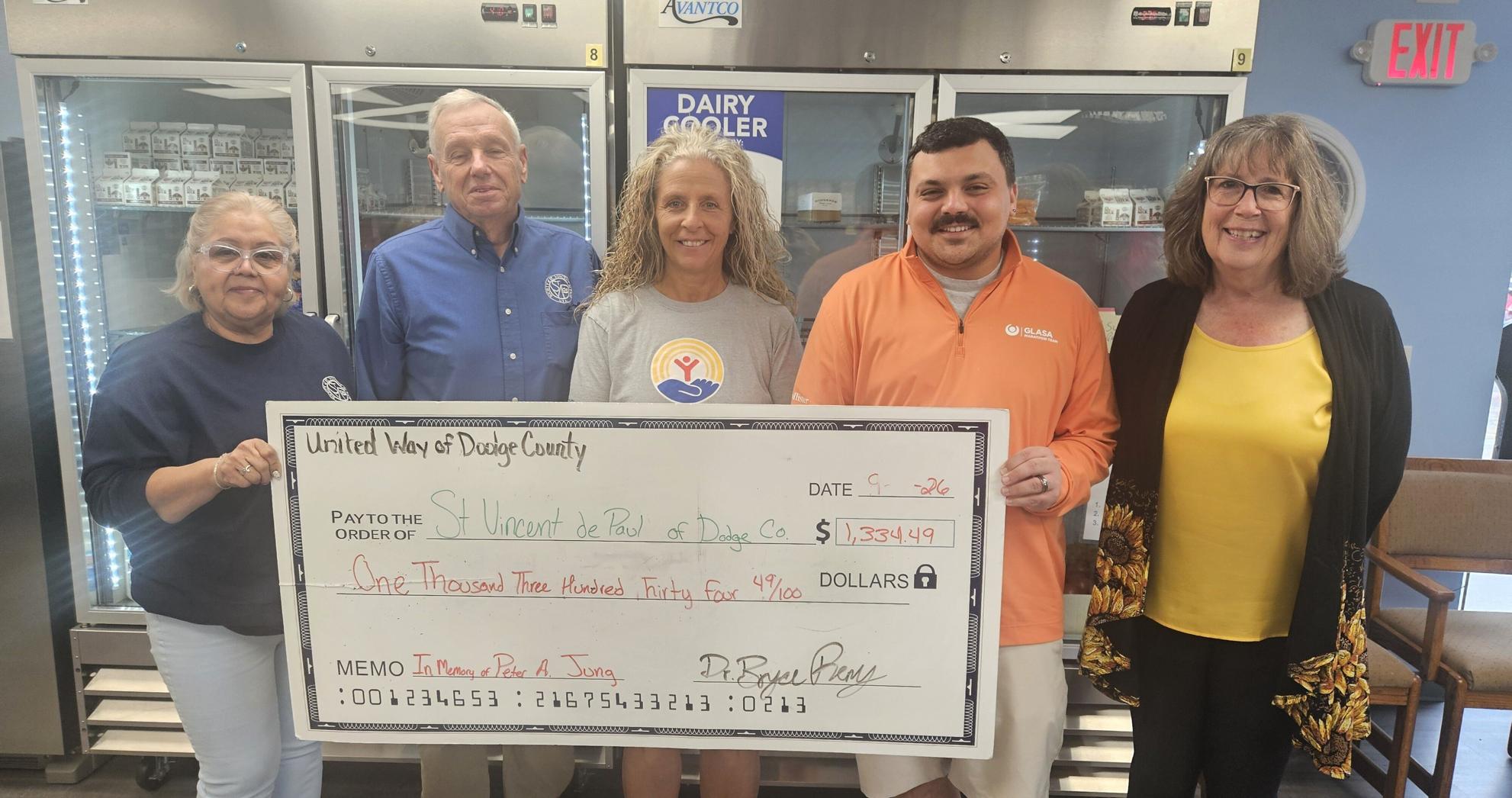 United Way of Dodge County awards $1,334.49 to Dodge County Food Pantry on Sept. 21. From left, Idalia Lopez, DCFP manager; Jim Hafenstein, St. Vincent DePaul District Council president; Tammy Appel, UWDC secretary; Bryce Remy, UWDC president; Gail Nampel, St Vincent DePaul District Council treasurer.