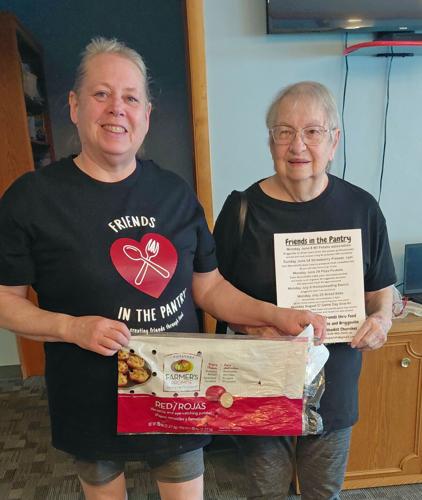 Brenda and Shirley Scherbert at the potato workshop held on June 8.