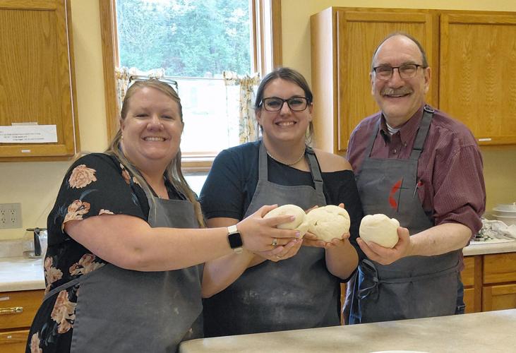 Jayme Roller, Zaranna Losic and Pastor Jim Cotter making Bread as part of the Friends in the Pantry group classes.