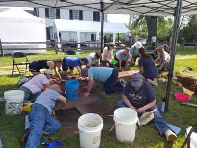 Archaeologist Judy Crook, front right, helps supervise a test unit at the 2025 archaeology dig at the Historic Indian Agency House.